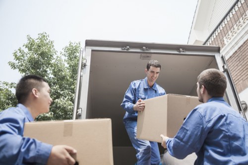 Unloading furniture at a new home with man and van service