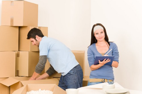 Professional movers assisting with loading a truck